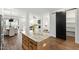 Bright open concept kitchen with marble island, pantry and stainless steel appliances at 248 Daniel Ridge Rd, Wendell, NC 27591
