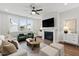 Inviting living room with a fireplace, plush seating, and contemporary design at 248 Daniel Ridge Rd, Wendell, NC 27591