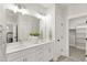 Main bathroom with double vanity, modern lighting, and luxurious finishes at 248 Daniel Ridge Rd, Wendell, NC 27591