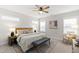 Bright main bedroom featuring a ceiling fan, stylish decor, and natural light at 248 Daniel Ridge Rd, Wendell, NC 27591