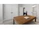 Bright office with large wooden desk, plenty of natural light, and storage closet at 248 Daniel Ridge Rd, Wendell, NC 27591