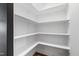 Walk-in pantry with bright white walls and adjustable shelving for ample storage space at 248 Daniel Ridge Rd, Wendell, NC 27591