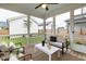Cozy screened porch with comfortable seating and a view of the backyard at 248 Daniel Ridge Rd, Wendell, NC 27591