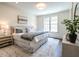Comfortable bedroom featuring a queen-size bed, neutral colors, and ample natural light at 2637 Sidford Aly, Raleigh, NC 27608