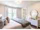 Bedroom featuring neutral tones, a modern ceiling fan, and an attached bathroom at 2637 Sidford Aly, Raleigh, NC 27608