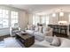 Bright living area with an open floor plan, offering a seamless transition from the living room to the kitchen at 2637 Sidford Aly, Raleigh, NC 27608