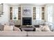 Cozy living room features a fireplace, built-in bookshelves, and comfortable seating, creating an inviting and stylish space at 2637 Sidford Aly, Raleigh, NC 27608