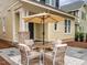 Outdoor patio with an umbrella and comfortable seating area at 2637 Sidford Aly, Raleigh, NC 27608