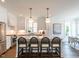 Spacious kitchen with a large island, pendant lighting, stainless appliances and hardwood floors at 2641 Sidford Aly, Raleigh, NC 27608
