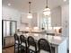 Bright kitchen features a large island, stainless steel appliances, and ample counter space at 2641 Sidford Aly, Raleigh, NC 27608