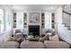 Inviting living room featuring a fireplace with built-in shelving, offering a blend of comfort and style at 2641 Sidford Aly, Raleigh, NC 27608