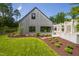 Modern home with a landscaped yard and an architectural walkway at 295 Lystra Preserve Dr, Chapel Hill, NC 27517