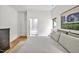 Bright bedroom with a view to the tiled bathroom and a minimalist design at 295 Lystra Preserve Dr, Chapel Hill, NC 27517