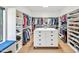 Spacious walk-in closet with custom shelving and ample storage for clothing and shoes at 295 Lystra Preserve Dr, Chapel Hill, NC 27517