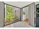Bright entryway featuring concrete floors and a large window to the courtyard garden at 295 Lystra Preserve Dr, Chapel Hill, NC 27517