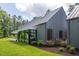 Stylish home with sleek lines and large windows, surrounded by lush landscaping at 295 Lystra Preserve Dr, Chapel Hill, NC 27517