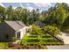 Aerial view of home featuring a fenced backyard, grass lawn, and well-manicured shrubbery at 295 Lystra Preserve Dr, Chapel Hill, NC 27517