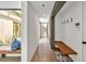 Bright hallway with polished concrete floors, clerestory windows, and built-in bench seating with modern design at 295 Lystra Preserve Dr, Chapel Hill, NC 27517