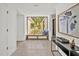 Modern hallway with bench seating and views of the landscaped outdoor living area at 295 Lystra Preserve Dr, Chapel Hill, NC 27517
