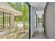 Hallway featuring polished concrete floors, and a view of the pool area through large glass doors at 295 Lystra Preserve Dr, Chapel Hill, NC 27517