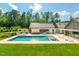 A refreshing pool and spa create a serene outdoor retreat, complete with lounge areas and manicured landscaping at 295 Lystra Preserve Dr, Chapel Hill, NC 27517