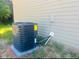 New air conditioner with energy guide sits on concrete pad outside home at 300 Saturn St, Dunn, NC 28334