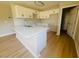 Modern kitchen featuring white cabinetry, a center island with sink, and stylish countertops at 300 Saturn St, Dunn, NC 28334