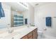 Bathroom features double sinks, neutral color palette and tub with shower at 30155 Pharr, Chapel Hill, NC 27517