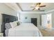 Comfortable bedroom featuring a ceiling fan, neutral walls, and a king-sized bed with white bedding at 30155 Pharr, Chapel Hill, NC 27517