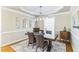 Formal dining room with a wood table, leather chairs, and stylish decor at 30155 Pharr, Chapel Hill, NC 27517