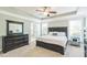 Spacious main bedroom featuring a tray ceiling, dresser, and abundant natural light at 30155 Pharr, Chapel Hill, NC 27517