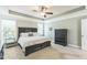 Tranquil main bedroom with a tray ceiling, soft lighting, and neutral decor at 30155 Pharr, Chapel Hill, NC 27517