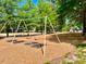 Playground with swings and climbing structures provides recreational activities for families at 30155 Pharr, Chapel Hill, NC 27517
