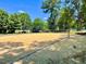 A sandy volleyball court with a net and a ball ready for a game at 30155 Pharr, Chapel Hill, NC 27517