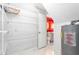 Storage room leading to vibrant powder room with decorative vanity and wallpaper at 3027 Truitt Dr, Burlington, NC 27215