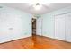 Bedroom featuring two closets and hardwood floors at 3027 Truitt Dr, Burlington, NC 27215