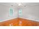 This room has hardwood floors and two windows that provide ample natural light at 3027 Truitt Dr, Burlington, NC 27215