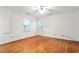 Cozy bedroom with two windows and hardwood flooring at 3027 Truitt Dr, Burlington, NC 27215