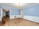 Dining room with blue walls, chair rail molding, and a chandelier at 3027 Truitt Dr, Burlington, NC 27215
