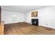 Bright living room featuring a fireplace, hardwood floors, and natural light at 3027 Truitt Dr, Burlington, NC 27215