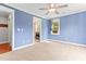 Bright bedroom with large window, ceiling fan, and bathroom access, creating a comfortable retreat at 305 Georgetown Rd, Raleigh, NC 27608