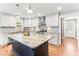 Bright kitchen with a large island and white cabinetry, perfect for entertaining at 305 Georgetown Rd, Raleigh, NC 27608