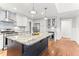 Well-equipped kitchen with granite island, stainless appliances, and custom cabinetry at 305 Georgetown Rd, Raleigh, NC 27608