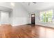 Bright living room showcasing hardwood floors, natural light, and an inviting front entryway at 305 Georgetown Rd, Raleigh, NC 27608