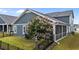 Backyard featuring a screened porch, flowering tree, and a black metal fence at 33 Davidson St, Clayton, NC 27527