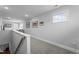 This hallway leads to a living room area with a window that provides natural light at 33 Davidson St, Clayton, NC 27527