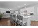 Open-concept kitchen with a large center island and views into the living room, perfect for entertaining at 33 Davidson St, Clayton, NC 27527