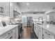 Modern kitchen with stainless steel appliances, white cabinets, and quartz countertops at 33 Davidson St, Clayton, NC 27527