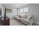 This living room features a TV and two chairs at 33 Davidson St, Clayton, NC 27527