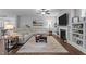 Comfortable living room with a large sectional sofa, fireplace, and built-in bookshelves at 33 Davidson St, Clayton, NC 27527